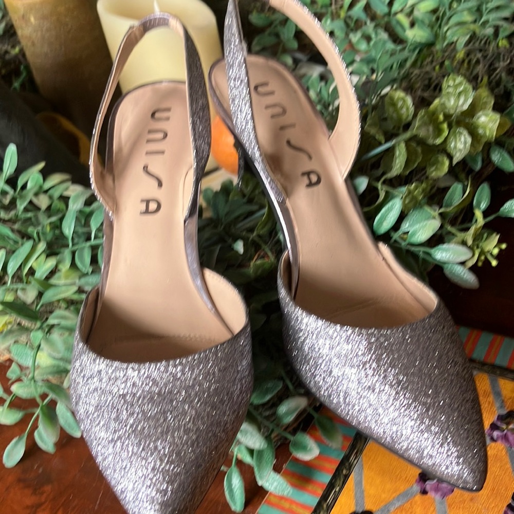 Unisa silver glitter sling backs.3inheel.      Excellent dress up or down 8-1/2